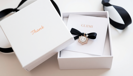 demi fine jewelry with glimii thank you card whitle box with glimii logo and black ribbon