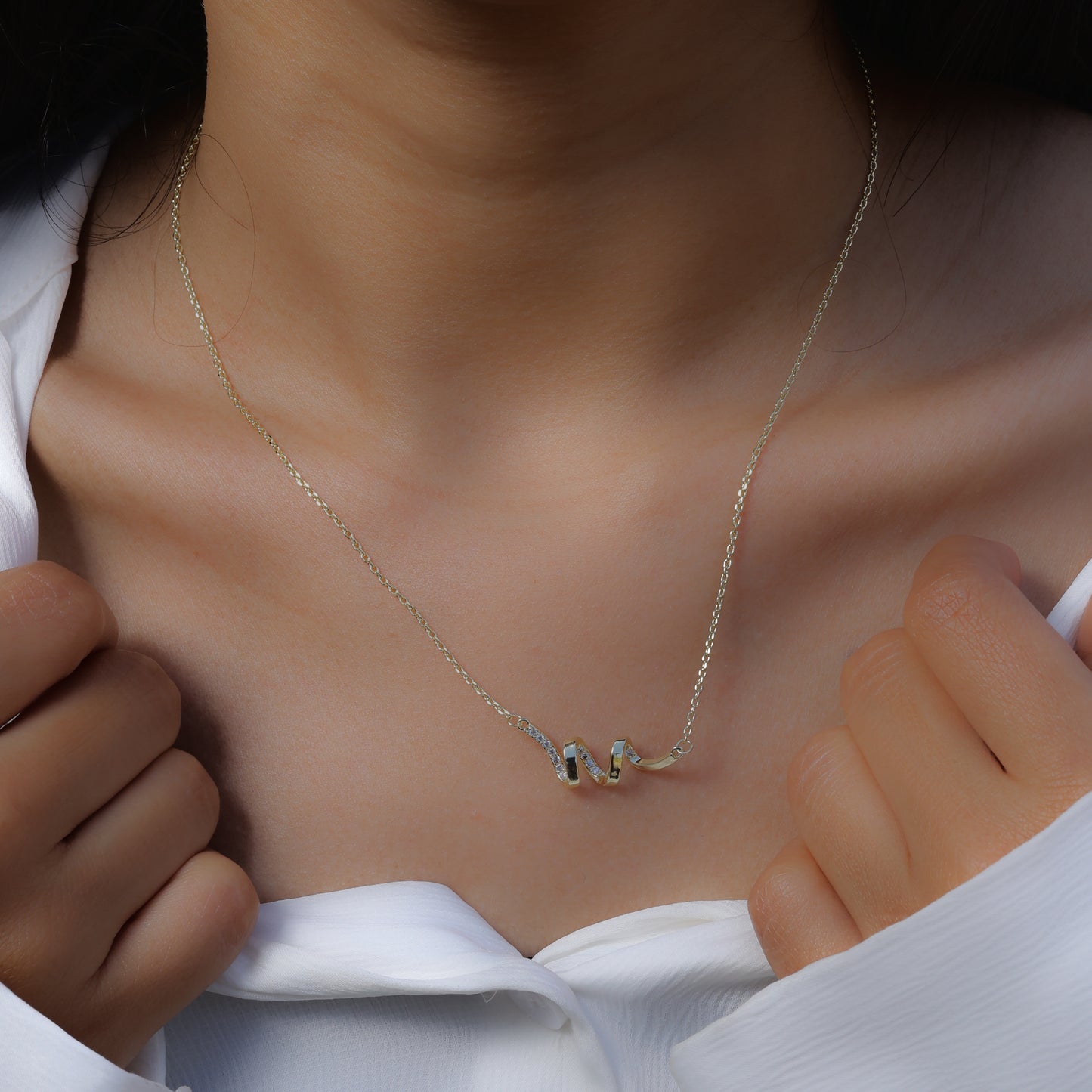 Delicate silver necklace with abstract pendant worn as Korean style jewelry by Glimii