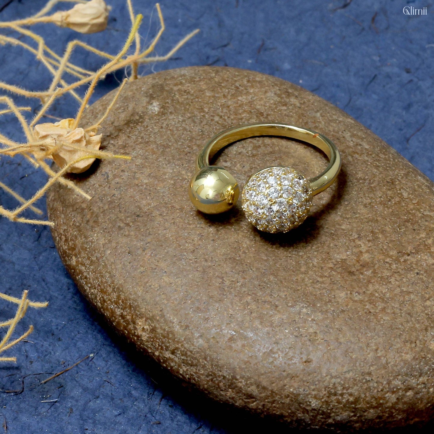 Glimii gold dainty everyday stacking ring with one smooth and one crystal-studded sphere on stone