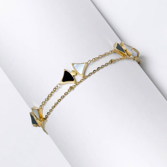 Glimii delicate gold layering bracelet with black and white triangle charms on gold chains