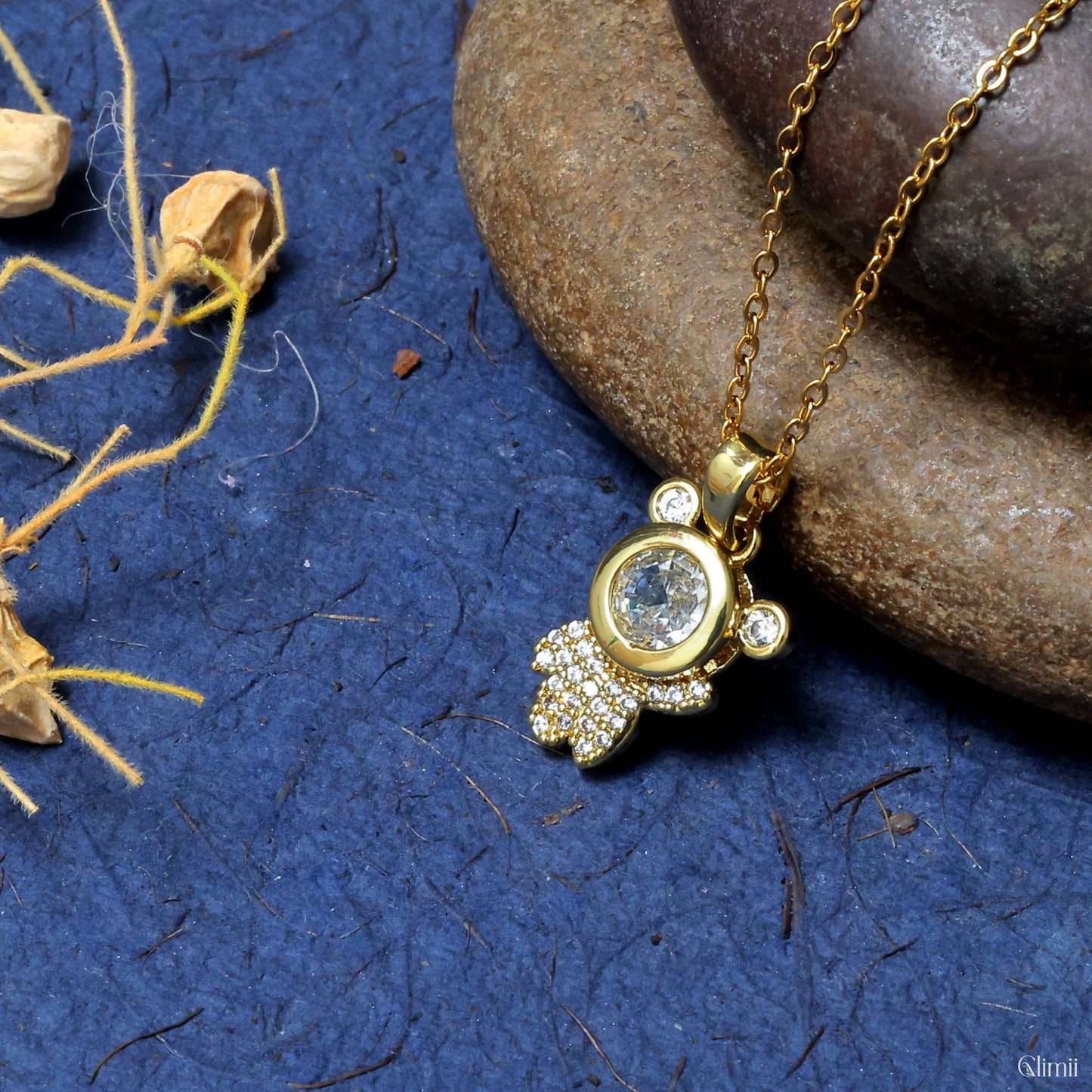 Glimii gold stainless steel astronaut charm necklace with crystal details on a chain