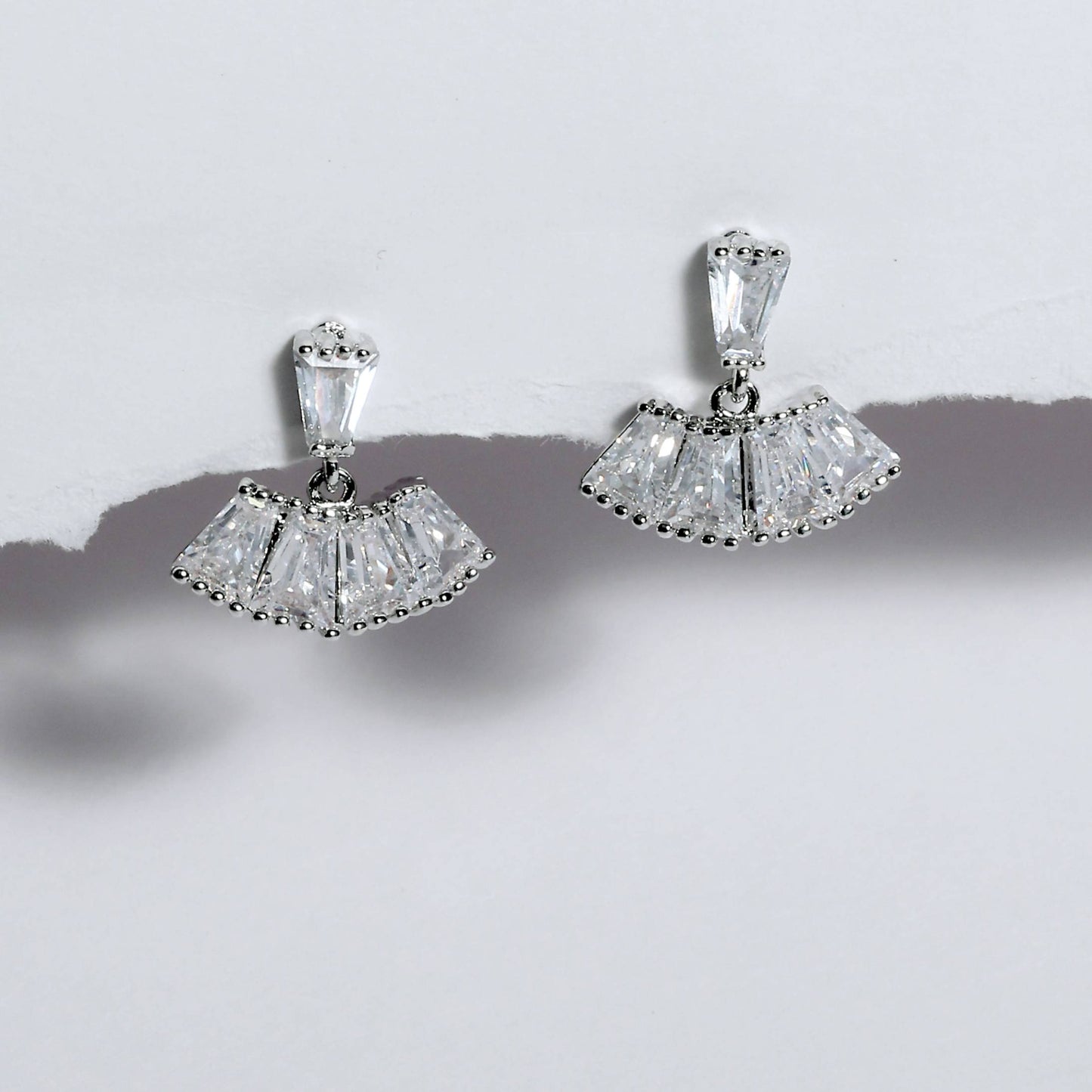 Glimii minimalist stainless steel earrings with clear geometric crystals in a fan shape