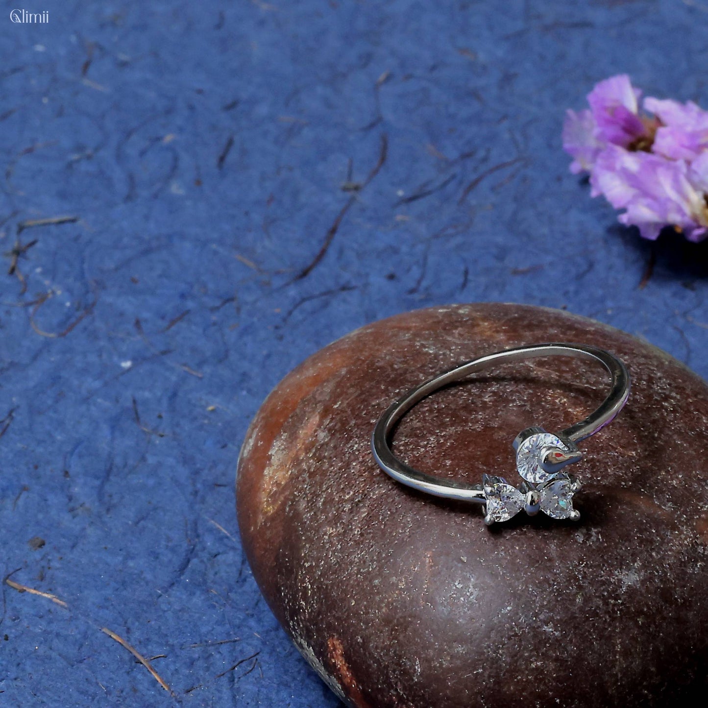Glimii minimalist bow ring for women with silver band and crystal bow design on a stone