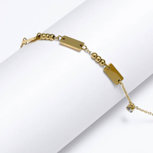 Glimii gold minimalist bracelet with rectangular plates and small round beads on delicate chain