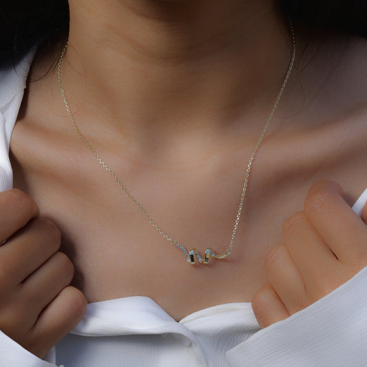 Delicate silver necklace with abstract pendant worn as Korean style jewelry by Glimii
