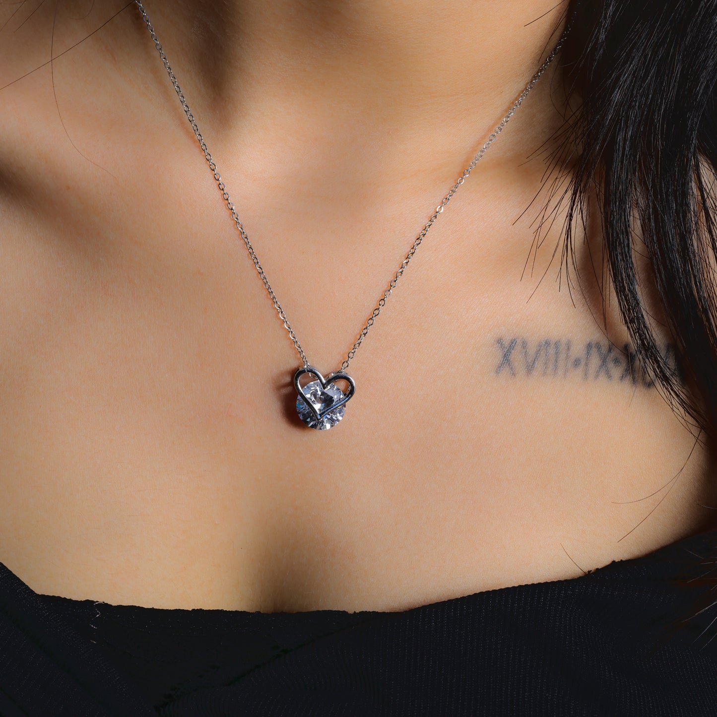 Glimii minimalist heart necklace with silver chain and heart-shaped pendant worn on neck