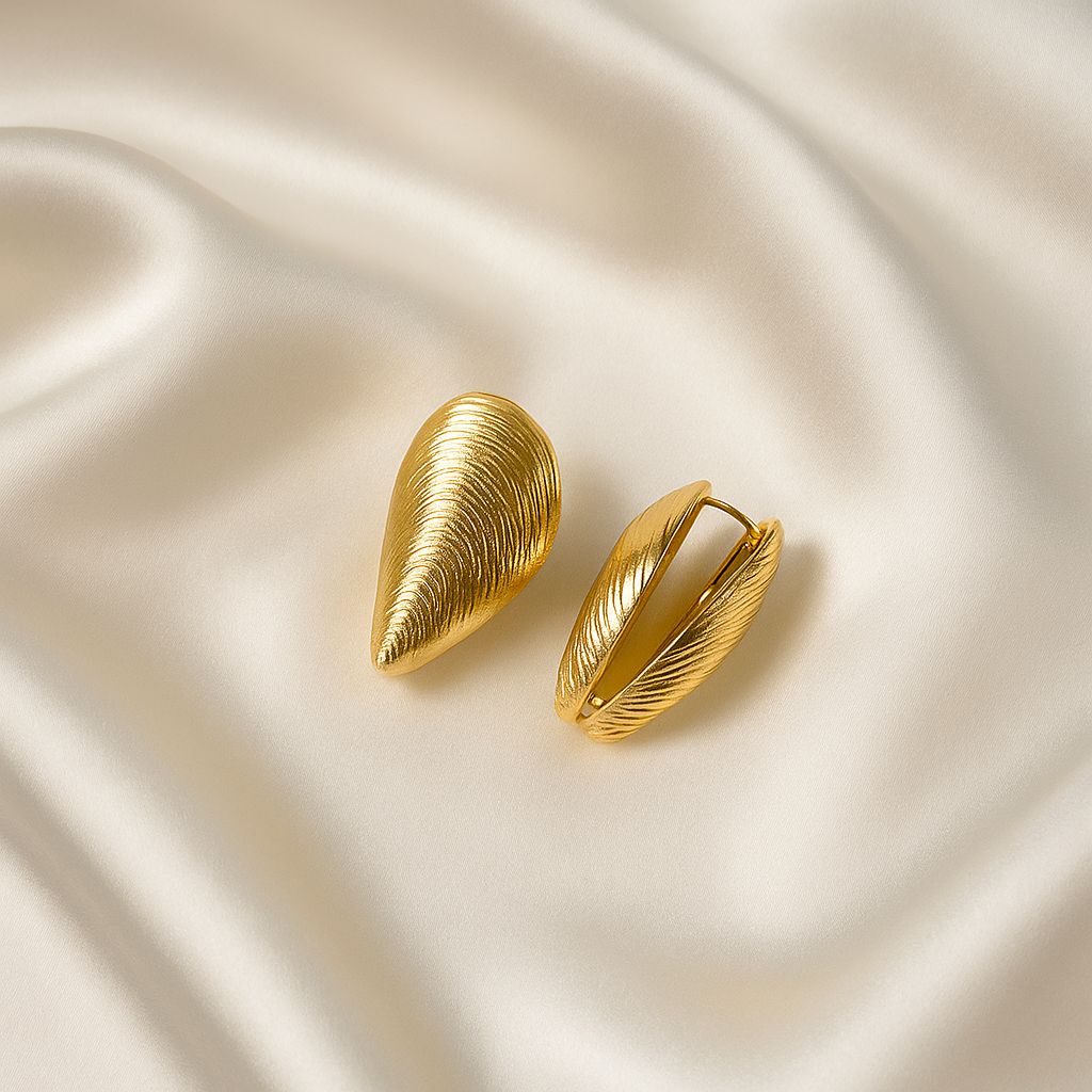 Glimii Korean style gold jewelry leaf shaped clip-on earrings on cream satin fabric