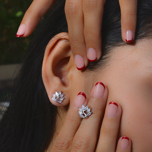Glimii Korean style stud earrings shaped like elegant silver floral designs worn on ear