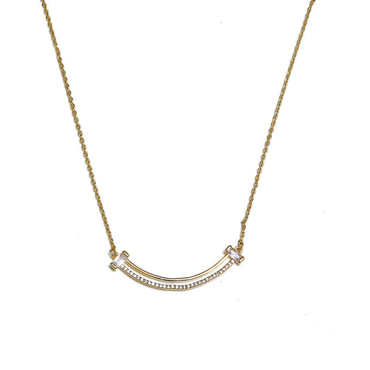 Glimii gold layered aesthetic necklace with curved bar and small clear stones