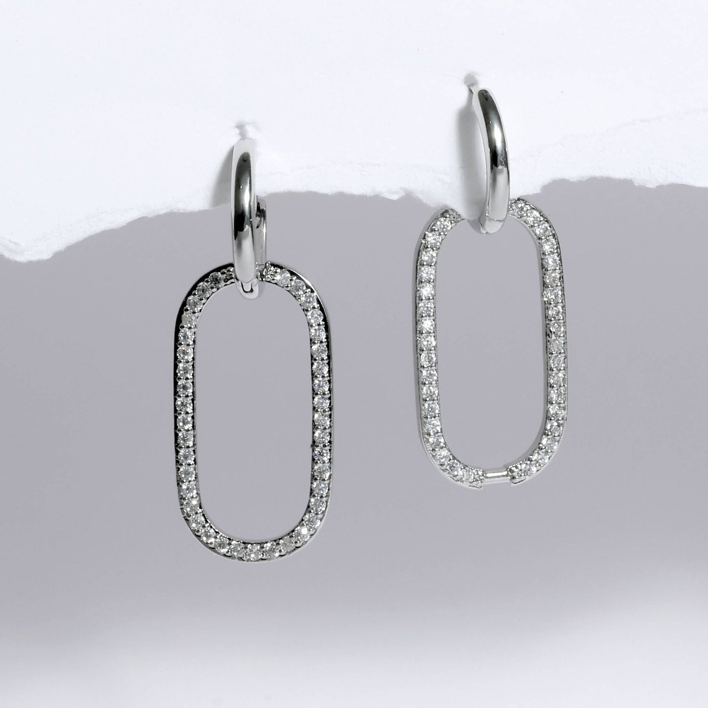 Glimii silver minimalist statement earrings with oval-shaped diamond-encrusted dangling loops