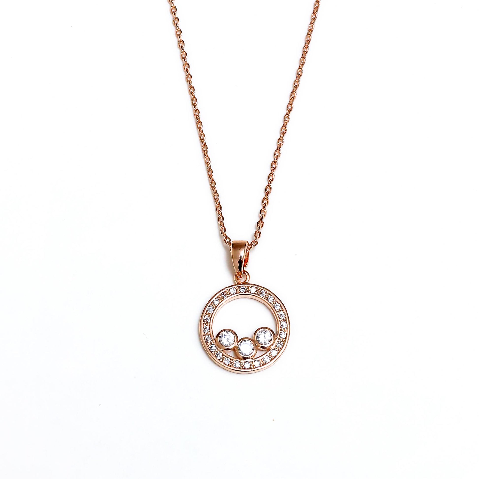 Glimii rose gold stainless steel dainty necklace with circular pendant and three sparkling crystals