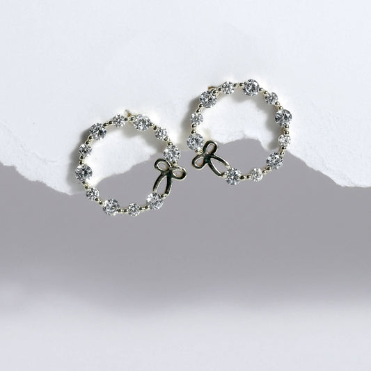 Glimii stainless steel hoop earrings with sparkling crystals and delicate bow design