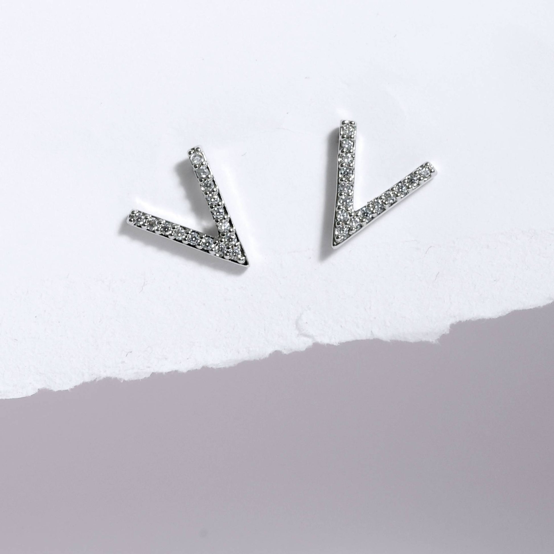 Glimii stainless steel stud earrings shaped like small V with embedded crystals