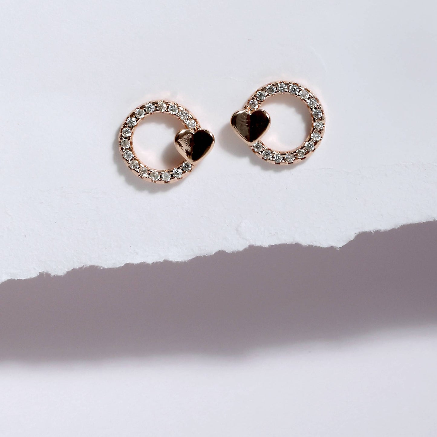 Glimii minimalist heart earrings with sparkling stones and small heart detail on white background